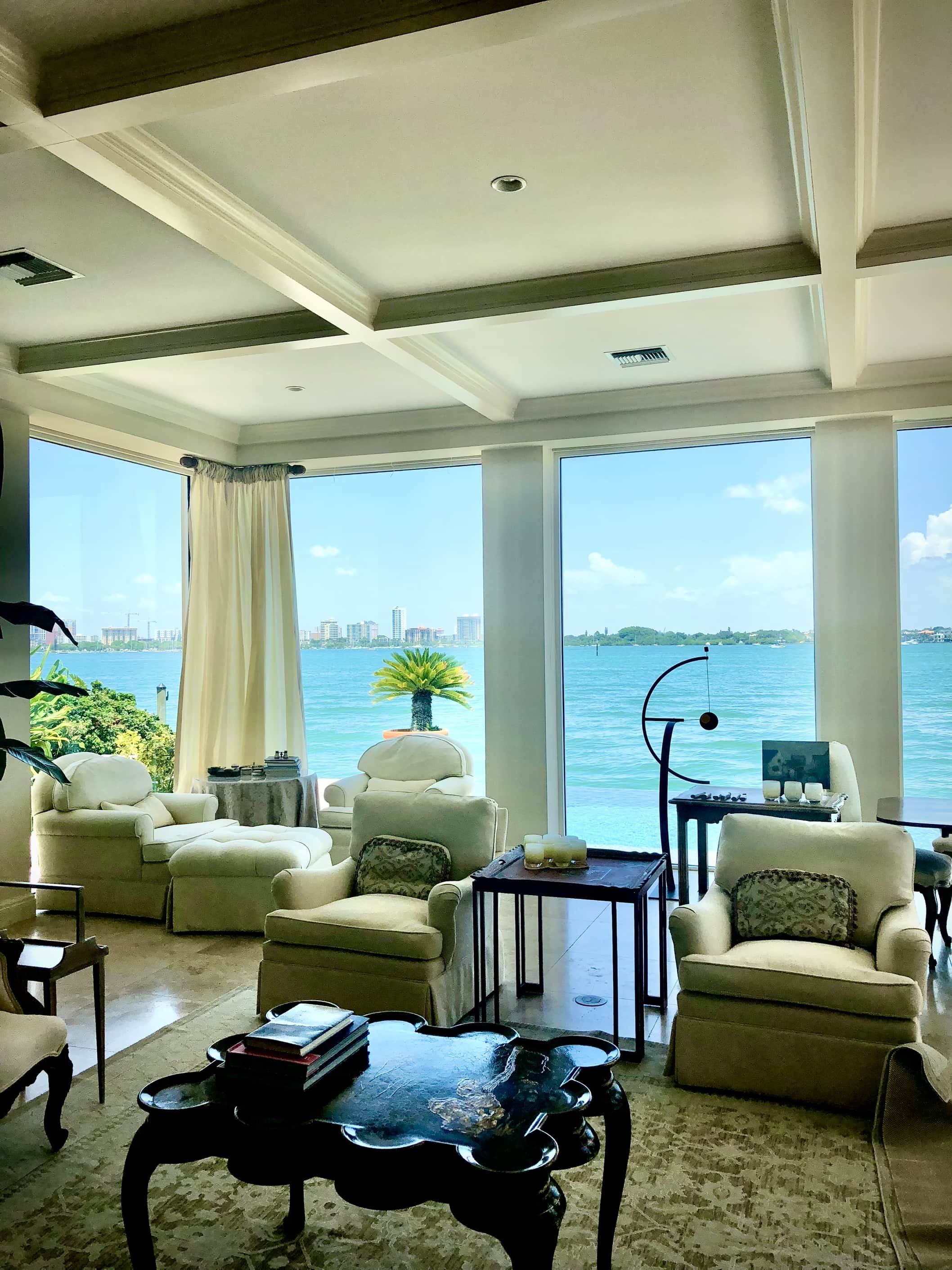 Stunning waterfront living room with coffered ceiling and professional interior paint